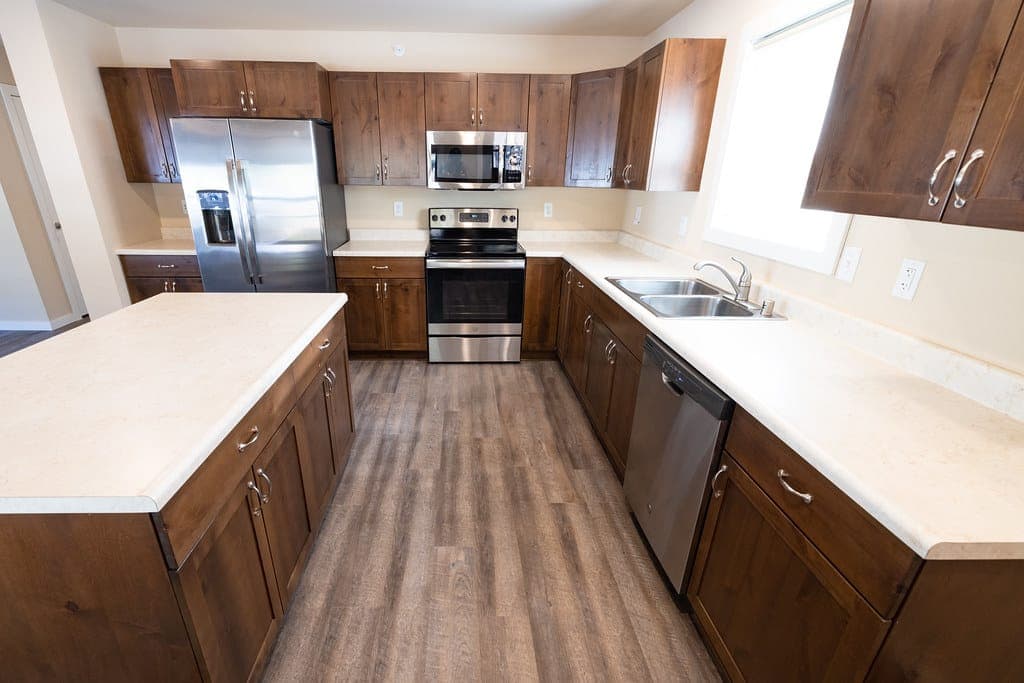 A simple fitted kitchen with worktop and cabinets
